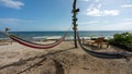 Beautiful shot of the hammocks near the beach under the blue sky in Utila, Honduras Royalty Free Stock Photo