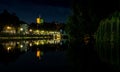 Beautiful shot of Heilbronn City with lights reflecting on the Neckar River during nighttime