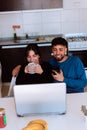 Beautiful shot of Hispanic couple sitting and drinking coffee together in the kitchen in Argentina Royalty Free Stock Photo