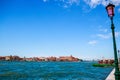 Beautiful shot of historic buildings across the canal under a blue sky in Venice, Italy Royalty Free Stock Photo