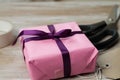 Beautiful shot of a homemade packaging of a gift with a tag on the table Royalty Free Stock Photo