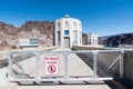 Beautiful shot of the Hoover Dam on a sunny day, Nevada, with the no public access sign on the fence