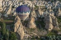 Beautiful shot of the hot air balloons over a landscape in the Cappadocia area in Turkey Royalty Free Stock Photo