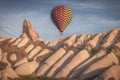 Beautiful shot of the hot air balloons over a landscape in the Cappadocia area in Turkey Royalty Free Stock Photo