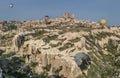 Beautiful shot of the hot air balloons over a landscape in the Cappadocia area in Turkey Royalty Free Stock Photo