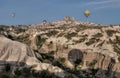 Beautiful shot of the hot air balloons over a landscape in the Cappadocia area in Turkey Royalty Free Stock Photo