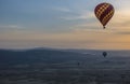 Beautiful shot of the hot air balloons over a landscape in the Cappadocia area in Turkey Royalty Free Stock Photo