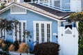 Beautiful shot of a house with light blue walls and white windows Royalty Free Stock Photo