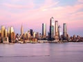 Beautiful shot of Hudson river against the Manhattan skyline, New York City at pink sunset Royalty Free Stock Photo