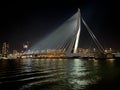 Beautiful shot of the illuminated Erasmus Bridge in Rotterdam at night