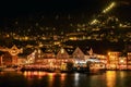 Beautiful shot of illuminated traditional buildings onshore in Bergen, Norway