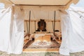 Beautiful shot of the interior of a rustic-style tent with beds for luxury camping
