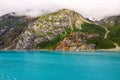 Beautiful shot of a landscape near water under the big white clouds Royalty Free Stock Photo