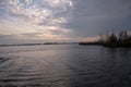 Beautiful shot of a large canal under a bright cloudy sky