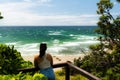 Beautiful shot of a Little Wategos beach and a woman admiring a natural view Royalty Free Stock Photo