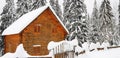 Beautiful shot of a log house covered with snow on a cold winter day in the forest Royalty Free Stock Photo