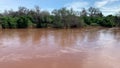 Beautiful shot of Luvuvhu river in flood with trees and blue cloudy sky in Limpopo province, Africa