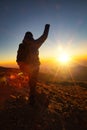 A beautiful shot of a male raising his hand while facing in the sierra negra volcano in Mexico Royalty Free Stock Photo