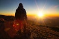 A beautiful shot of a male raising his hand while facing in the sierra negra volcano in MexicoA beautiful shot of sunrise a male Royalty Free Stock Photo