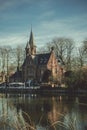 Beautiful shot of the Minnewater castle in a Minnewaterpark, Bruges Belgium Royalty Free Stock Photo