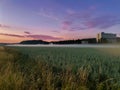 Beautiful shot of mist floating over rural areas of Tullinge, Stockholm, Sweden at sunset Royalty Free Stock Photo