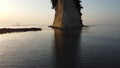 Beautiful shot of Mitsukejima diamond shaped island with plants and trees on top of the rock