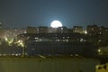 Beautiful shot of the moon over the beautiful city of Yerevan during nighttime