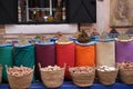 Beautiful shot of Moroccan spices in colorful sacks and wicker baskets at an outdoor market