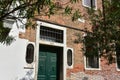 Beautiful shot of narrow street with residential houses, architecture in Venice Italy. Royalty Free Stock Photo