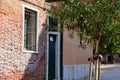 Beautiful shot of narrow street with residential houses, architecture in Venice Italy. Royalty Free Stock Photo