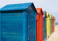 Beautiful shot of numerous colorful dressing rooms in a beach