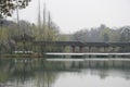 Beautiful shot of an oriental bridge over a pond in Hangzhou, China