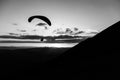 Beautiful shot of a paraglider silhouette flying over Monte Cucco Umbria, Italy, with sunset on the background Royalty Free Stock Photo