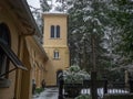 Beautiful shot of a part of a small church on a snowy day