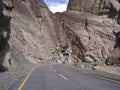 Beautiful shot of people with bikes on a road with canyon