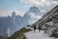 Beautiful shot of people hiking in the mountains In Three Peaks Nature Park In Toblach, Italy Royalty Free Stock Photo