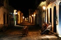 Beautiful shot of people sitting in an illuminated street in Paraty, Brazil