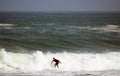 Beautiful shot of a person doing waves ride sport in the sea in the daylight