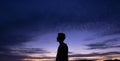 Beautiful shot of a person profile silhouette on a purple sunset sky