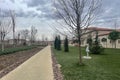 Beautiful shot of the Rami Library and its garden with visitors during a wintertime