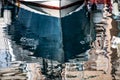 Beautiful shot of the reflection of a ship head in the water in Marseille, France