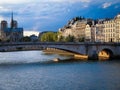 Beautiful shot of a river over the river Seine in Paris and the Notre Dame cathedral in the behind Royalty Free Stock Photo