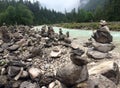 Beautiful shot of rocks balanced on each other near a lake in the forest Royalty Free Stock Photo