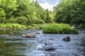 Beautiful shot of the Sacandaga River and the surrounding trees in the Adirondacks of New York State Royalty Free Stock Photo