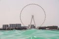Shot from the sea overlooking Dubai ferris wheel Royalty Free Stock Photo