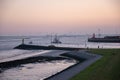 Beautiful shot of a seashore with boats during a sunset Royalty Free Stock Photo