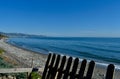 Beautiful shot of the seashore under a blue sky at Torrox Costa, Spain Royalty Free Stock Photo