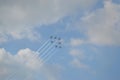 Beautiful shot of seven warplanes in the sky going in the same direction.