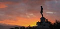 Beautiful shot of a silhouette of a sculpture in Florence in a bright sunset sky