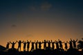 Beautiful shot of silhouettes of a group people during the sunset